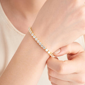 Amazon Essentials Yellow Gold Plated Sterling Silver Round Cut Cubic Zirconia Tennis Bracelet (4mm), 7" (previously Amazon Collection)