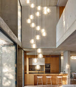 Load image into Gallery viewer, dolria Gold Modern Crystal Chandelier for Staircases 157&quot; Long Adjustable Ceiling Light for Entrance 3000K LED Hanging Lighting Living Room Hallway Entryway
