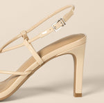 Load image into Gallery viewer, Amazon Essentials Women's Strappy Stiletto Heel Sandals, Beige Patent, 7.5
