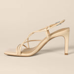 Load image into Gallery viewer, Amazon Essentials Women's Strappy Stiletto Heel Sandals, Beige Patent, 7.5
