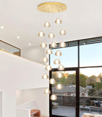 Load image into Gallery viewer, dolria Gold Modern Crystal Chandelier for Staircases 157&quot; Long Adjustable Ceiling Light for Entrance 3000K LED Hanging Lighting Living Room Hallway Entryway
