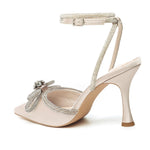 Load image into Gallery viewer, Athlefit Women&#39;s Rhinestone Bow Heels Ankle Strap Pointed Toe Stiletto Heeled Sandals Wedding Bridal Dress Pumps Shoes Apricot Size 8

