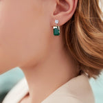 Load image into Gallery viewer, PHNIBIRD Emerald Earrings with Gold Melting Shape Elegant Solitaire Cubic Zirconia Green Earrings for Women Dangle
