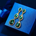 Load image into Gallery viewer, EleQueen Women&#39;s Gold-tone Austrian Crystal Teardrop Pear Shape 2.5 Inch Long Dangle Earrings Emerald Color
