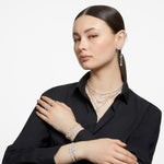 Load image into Gallery viewer, Swarovski Una Angelic Tennis Bracelet, Clear circle-cut Swarovski Crystals with Matching Crystal Pavé on a Rhodium Tone Finish Setting, Part of the Swarovski Una Angelic Collection
