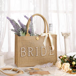 Load image into Gallery viewer, Silkfly Wedding Bride Bag Natural Jute Tote with Ribbon Bride Gift Bag with Handle for Shower(Gold Edges,Bride)
